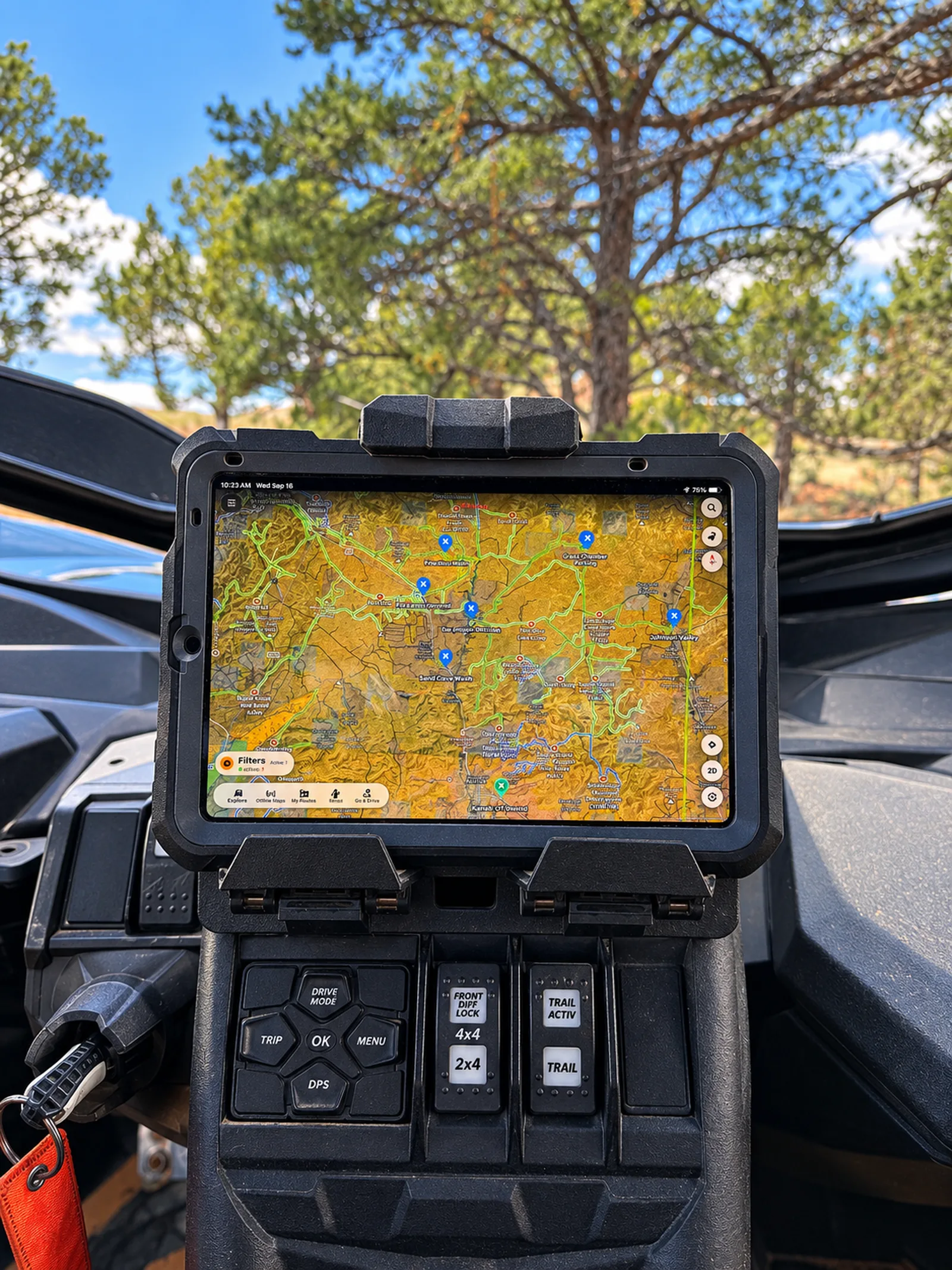 iPad mounted on a UTV dashboard showing turn-by-turn off-road navigation with preloaded waypoints
