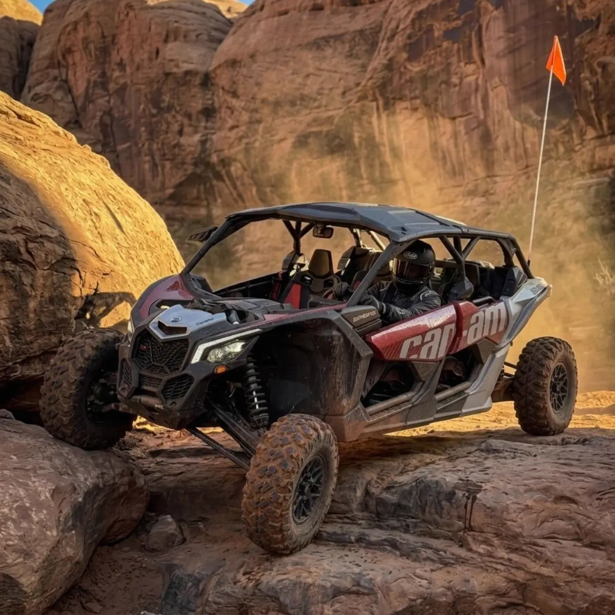 Can-Am UTV climbing red rock terrain in the Kanab backcountry